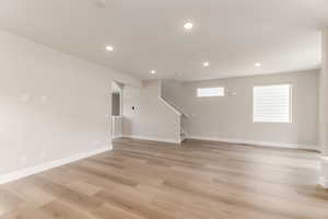 Unfurnished living room featuring recessed lighting and light wood finished floors