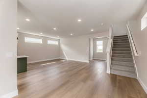 Unfurnished living room featuring light wood-style floors and recessed lighting