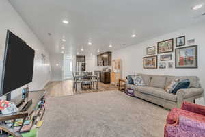 Living area featuring recessed lighting and light wood finished floors