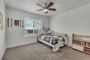 Bedroom with carpet and a ceiling fan
