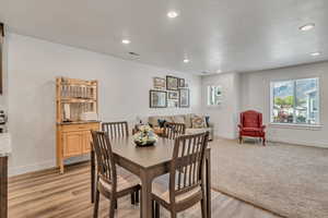 Dining area featuring light wood-style flooring and recessed lighting