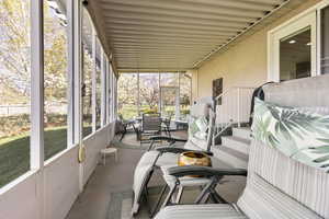 Sunroom with outdoor dining area