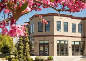 Rear view of house featuring brick siding