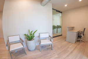 Office area with recessed lighting and a barn door