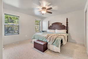 Bedroom with carpet floors and a ceiling fan