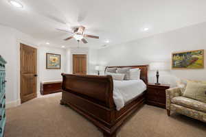 Bedroom featuring light carpet, a ceiling fan, and recessed lighting