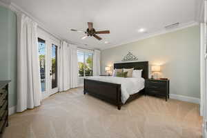 Bedroom with ornamental molding, access to outside, light colored carpet, recessed lighting, and a ceiling fan