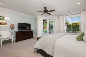 Carpeted bedroom with french doors, access to outside, ornamental molding, and a ceiling fan