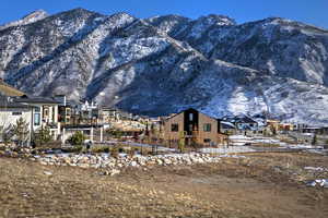 View of mountain background featuring nearby suburban area