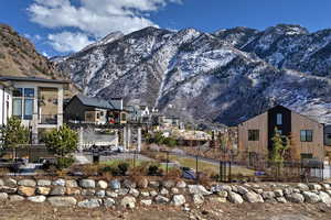View of mountain backdrop featuring nearby suburban area