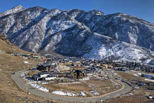 View of mountain backdrop featuring nearby suburban area