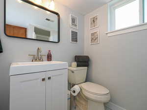 3/4 Bathroom with vanity and toilet basement