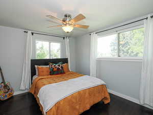 Bedroom featuring a ceiling fan and wood finished floors