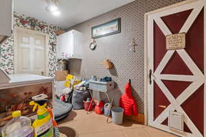 Miscellaneous room featuring light tile patterned floors