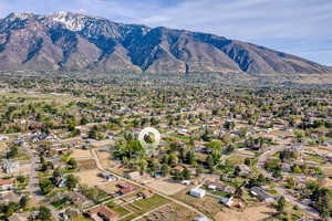 Aerial perspective of suburban area featuring a mountain backdrop