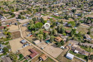 Aerial overview of property's location featuring nearby suburban area