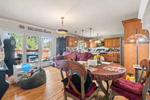 Dining area with light wood-type flooring