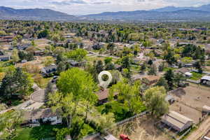 Aerial perspective of suburban area featuring a mountain backdrop
