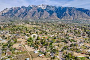 Aerial perspective of suburban area with a mountain backdrop
