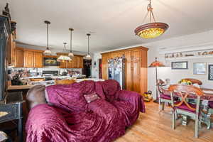 Living room with light wood-style flooring