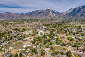 View of property location with a mountainous background and nearby suburban area