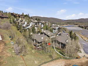 Aerial perspective of suburban area with a mountainous background