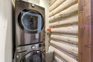 Laundry area with stacked washer / dryer
