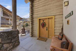 Entrance to property with log exterior