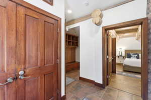 Hall featuring baseboards and recessed lighting
