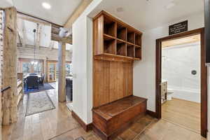 Mudroom featuring light wood-style floors, recessed lighting, and beam ceiling