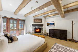 Bedroom featuring french doors, recessed lighting, beam ceiling, access to exterior, and light colored carpet