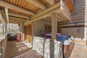 View of patio featuring a hot tub