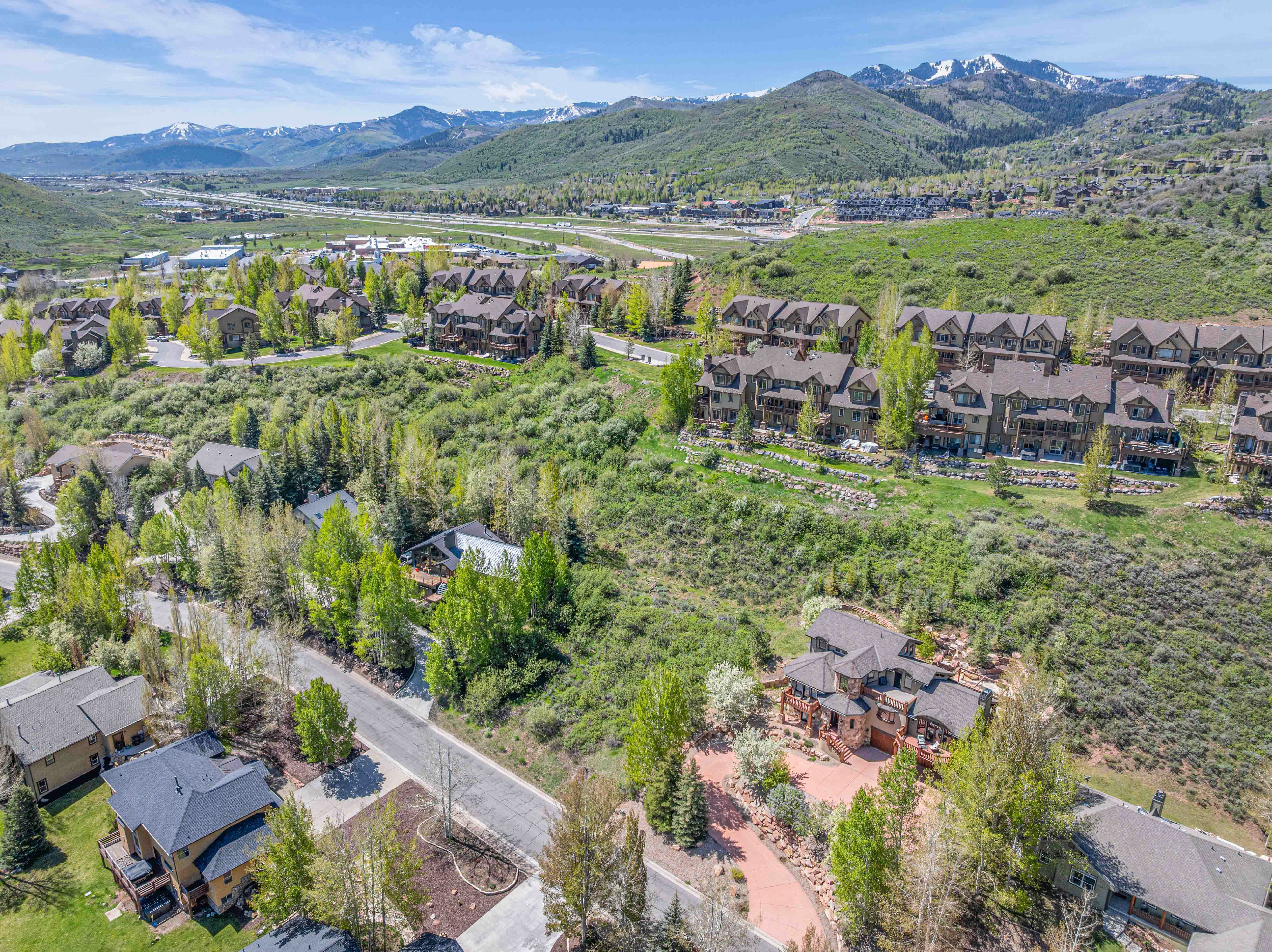 Aerial view of residential area featuring a mountainous background