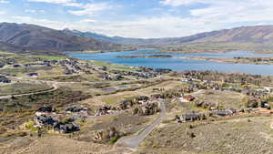 Aerial view of residential area featuring a water and mountain view
