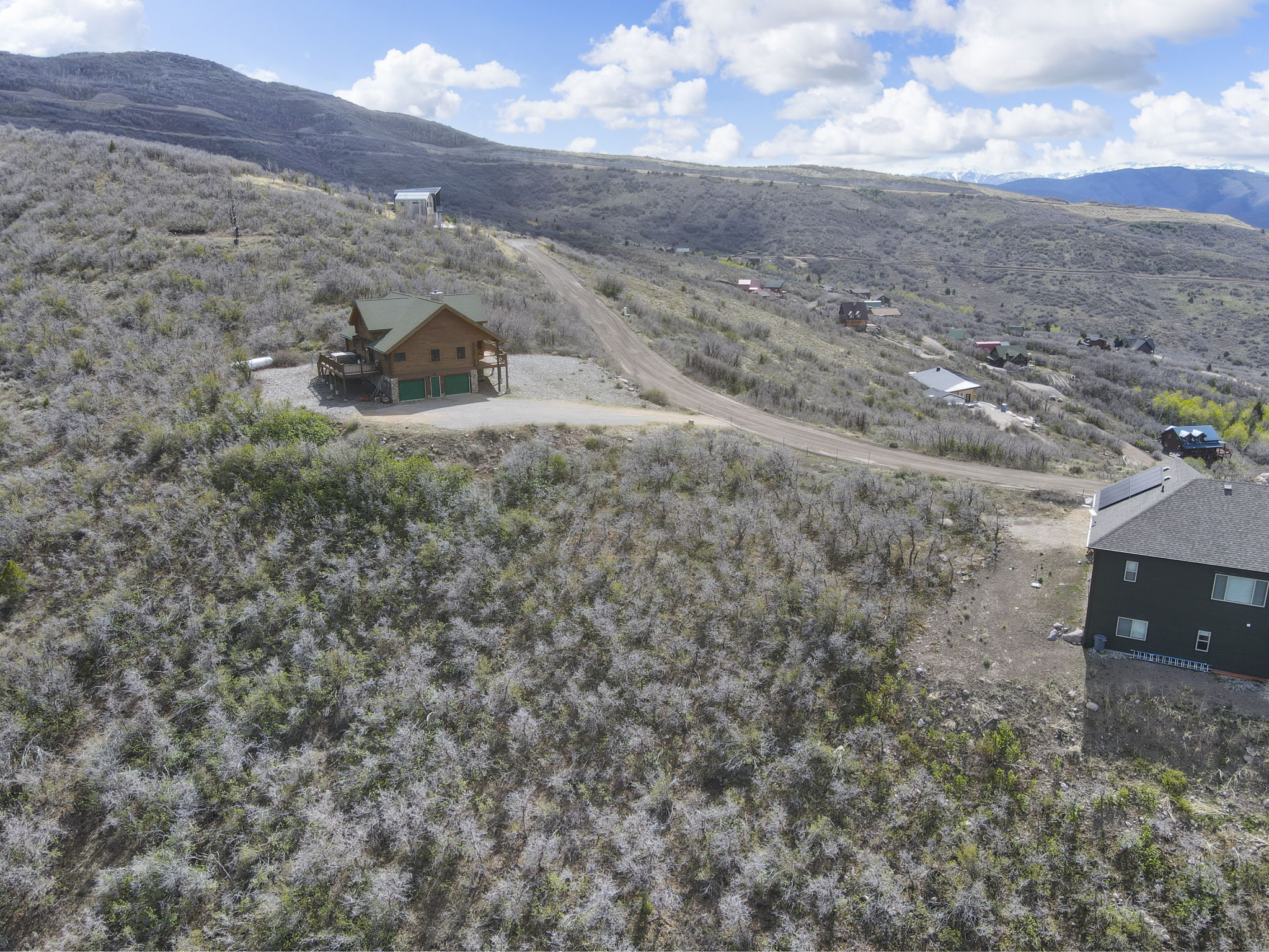 View from above of property with a mountainous background