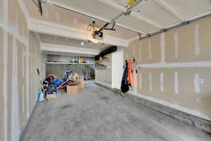 Garage featuring a garage door opener
