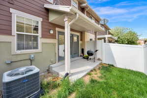 Doorway to property with stucco siding