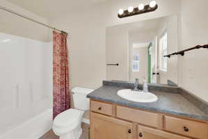 Full bathroom with vanity and shower / tub combo