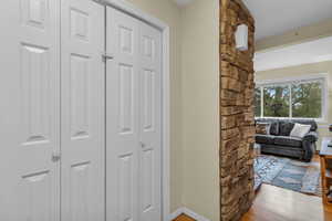 Hallway featuring baseboards and light wood-style flooring