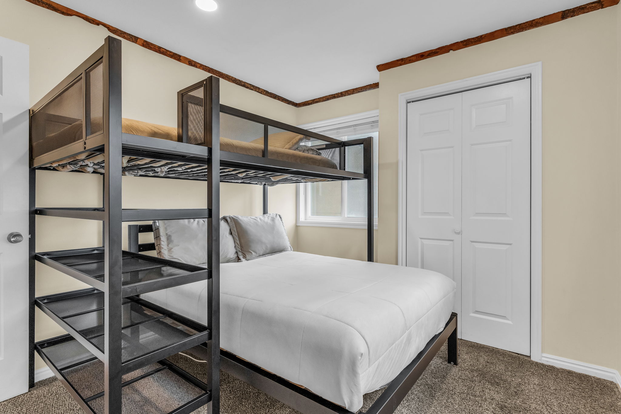 Bedroom featuring carpet flooring and a closet