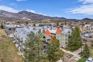 Aerial view of a mountainous background and apartment complex