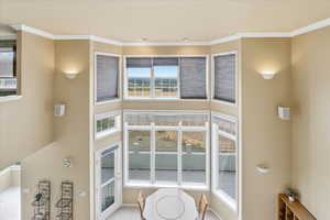 Detailed view of crown molding and baseboards