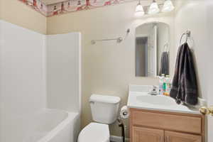 Full bath with vanity and bathtub / shower combination