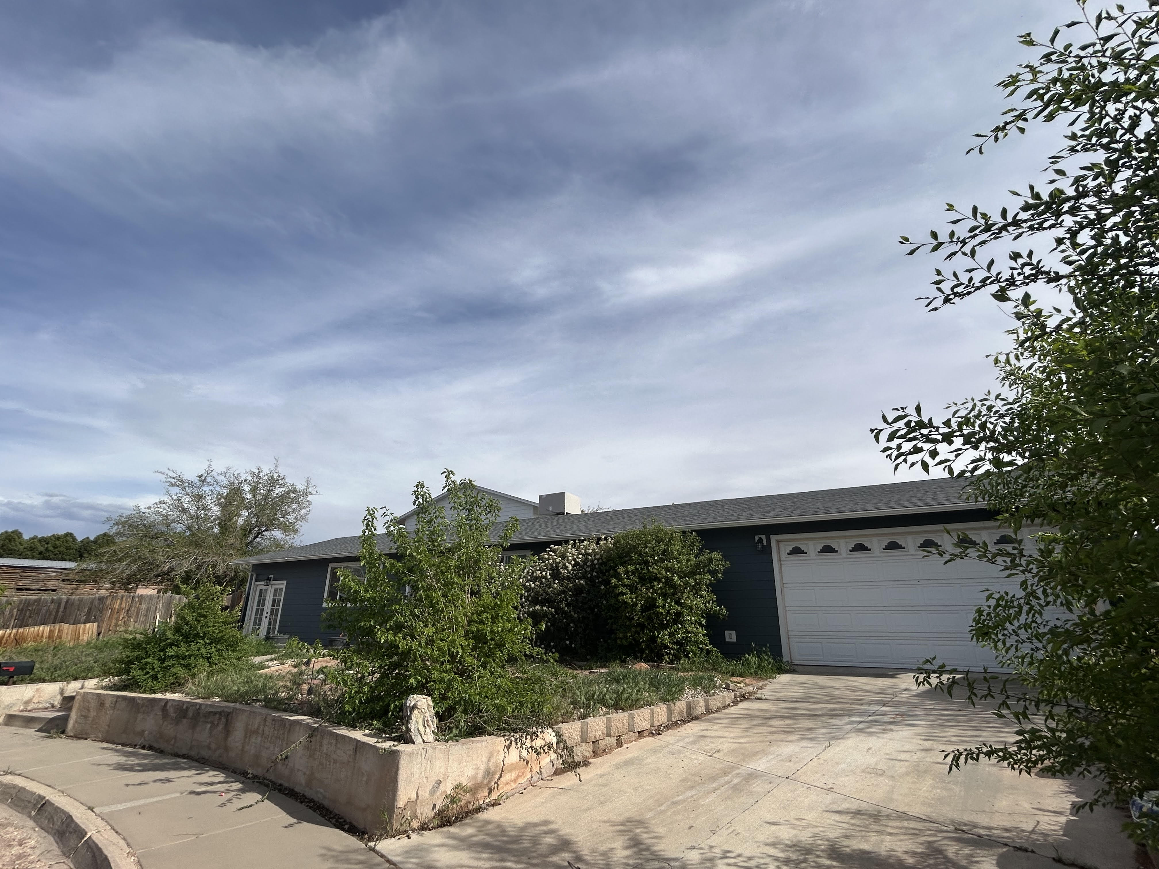 View of front of property with an attached garage.