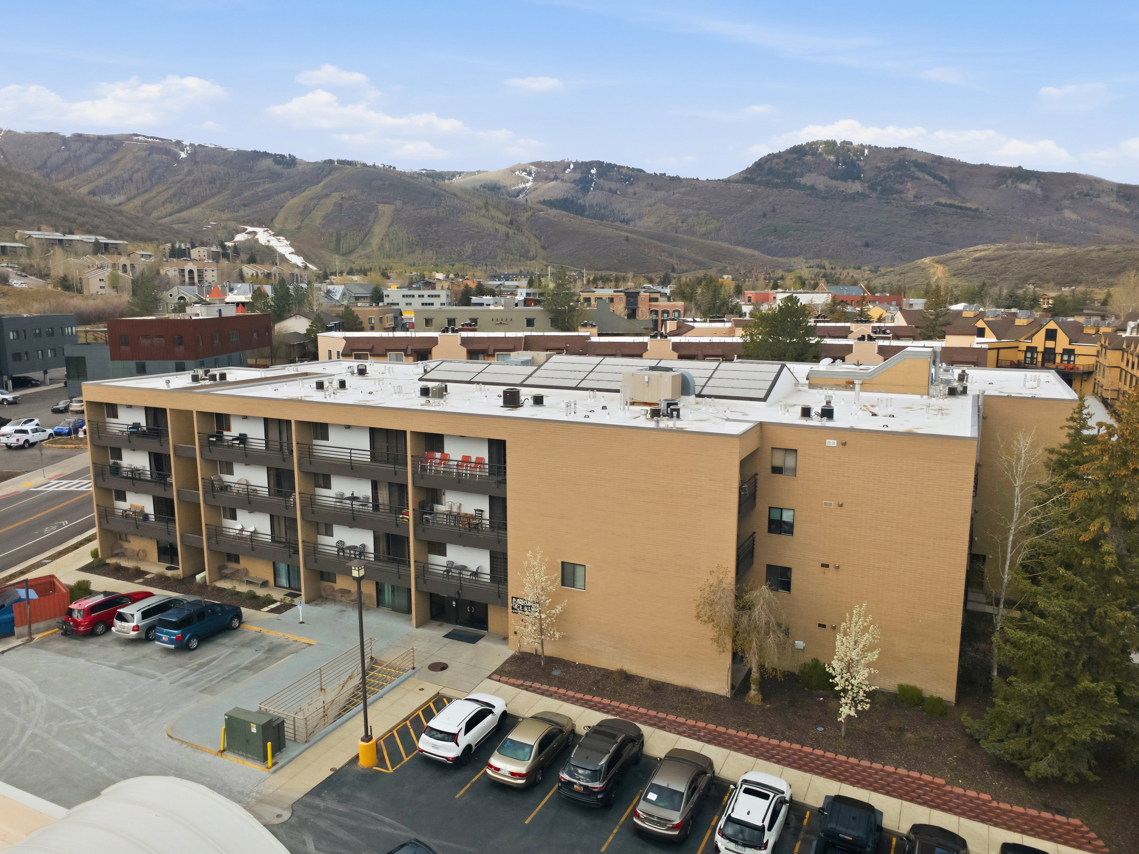 Drone / aerial view of mountains and apartment complex
