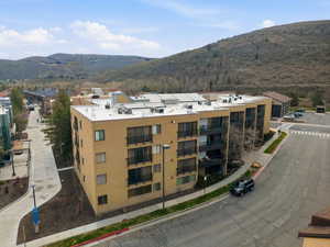 View of apartment building / complex featuring a mountain view