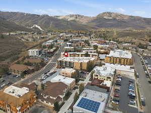 Aerial overview of property's location with a mountainous background