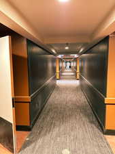 Hallway with light colored carpet