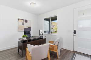 Office space featuring wood finished floors and baseboards