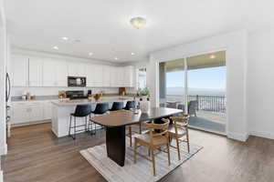 Dining area with light wood-type flooring, recessed lighting, and a mountain view